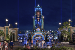 The illuminated entrance portal to Universal Epic Universe at night