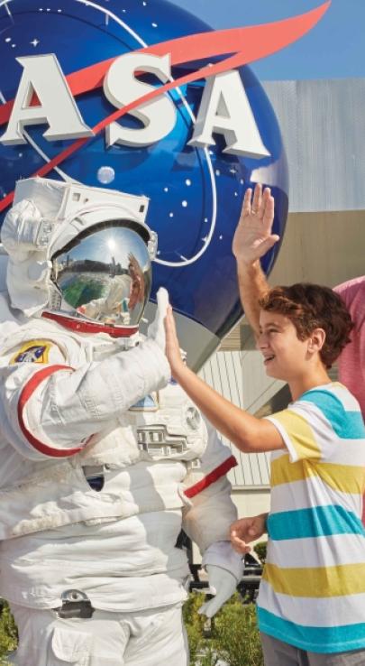 Family with astronaut at Kennedy Space Center Visitor Complex in Florida