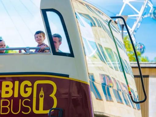 big bus london eye in the background