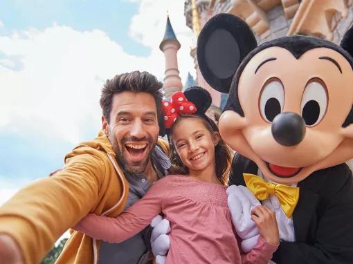 Family with Mickey in front of Sleeping Beauty Castle at Disneyland Paris