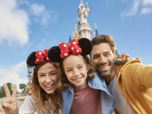 Family in front of Sleeping Beauty Castle at Disneyland Paris