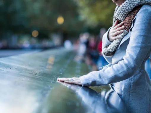 Woman at the Reflecting Pools at the 911 Memorial Museum in New York City