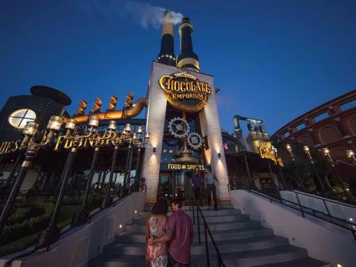 Couple entering the The Toothsome Chocolate Emporium & Savory Feast Kitchen at Universal CityWalk in Orlando