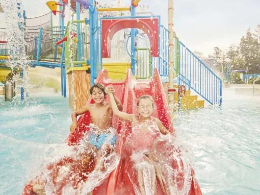 Kids playing in La Laguna de Woody play area at PortAventura Caribe Aquatic Park