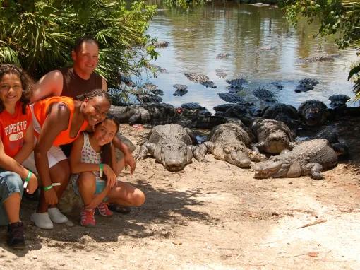 Family getting up-close with Alligators on an Adventure Tour at Gatorland in Florida