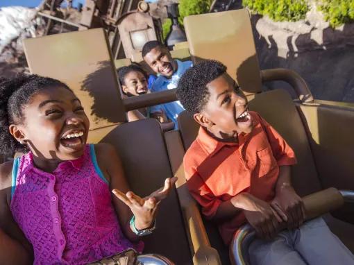 Boy and girl riding Expedition Everest - Legend of the Forbidden Mountain at Disney's Animal Kingdom