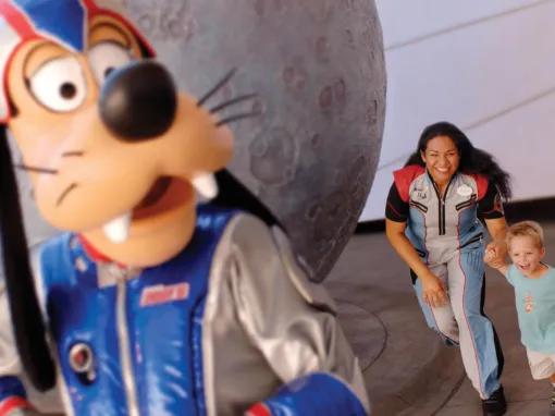 Goofy being chased by guests at Epcot