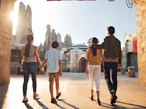 Family at the entrance to Star Wars Galaxy's Edge at Disney's Hollywood Studios