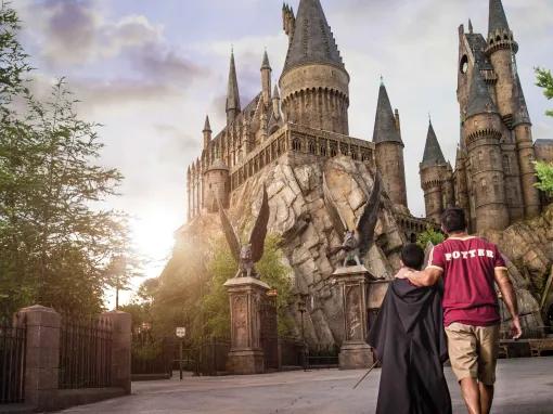 Father and son in front of Hogwarts Castle at Universal's Islands of Adventure