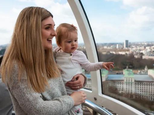 Mother and baby enjoying the views from a London Eye pod