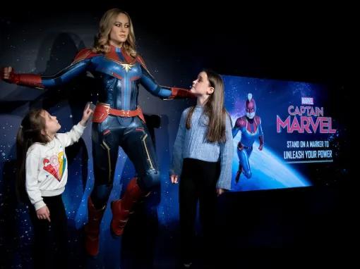 Girls with Captain Marvel at Madame Tussauds London