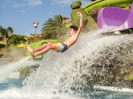 Boy on water slide at Universal's Volcano Bay Water Theme Park