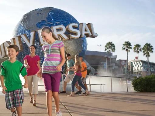 Boy and Girl in front of Universal Globe at Universal Orlando Resort