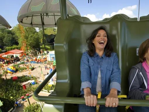 Mother and son enjoying Toy Soldiers Parachute Drop at Disneyland Paris