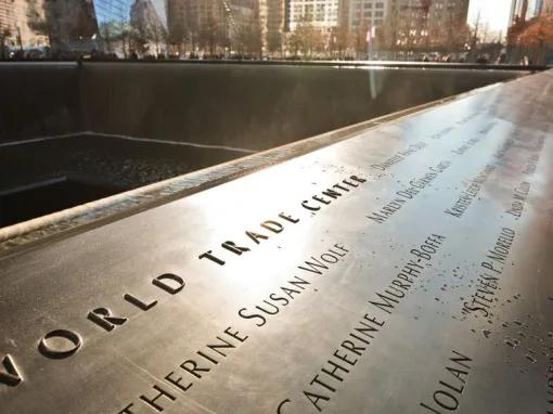 Names of victims of the 2001 and 1993 attacks inscribed into bronze panels surrounding the reflecting pools outside the 9/11 Memorial Museum