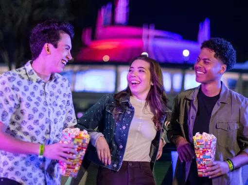 Teens enjoying snacks at Disney After Hours Boo Bash at Magic Kingdom Park