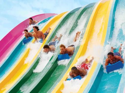 Teens racing down Taumata Racer at Aquatica Orlando