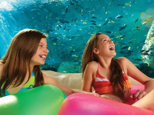 Girls floating along Loggerhead Lane at Aquatica Orlando