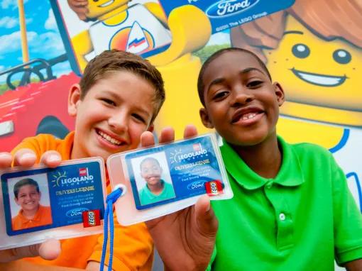 Kids showing off their LEGO driving licenses at LEGOLAND Florida