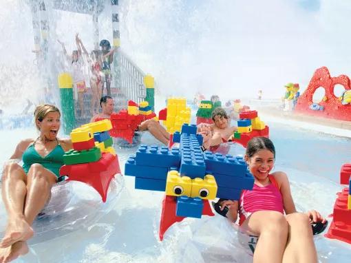 Family on Build-a-Raft Water ride at LEGOLAND Florida Water Park