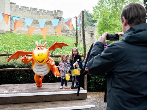 Kids taking photo with Zog the loveable dragon at Warwick Castle