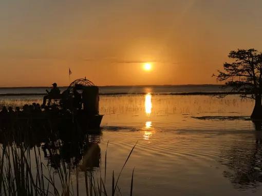 Airboat on the water as the sunsets on the Everglades