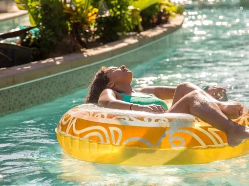 Girl chilling out on the Lazy River at Universal's Volcano Bay