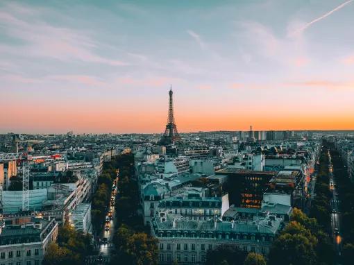 View of Paris from above, with streets and buildings leading to the Eiffel Tower