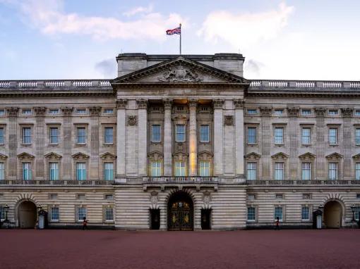 The front of Buckingham Palace with the Union Jack flying 