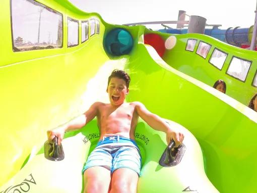 Guest riding a water slide at Aquatica