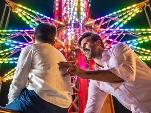 Father and Son in front of Star Flyer at Bollywood Parks Dubai