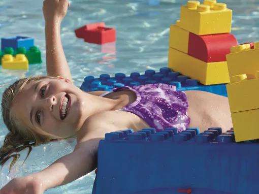 Girl riding on her Build-a-raft at LEGOLAND Water Park in Dubai