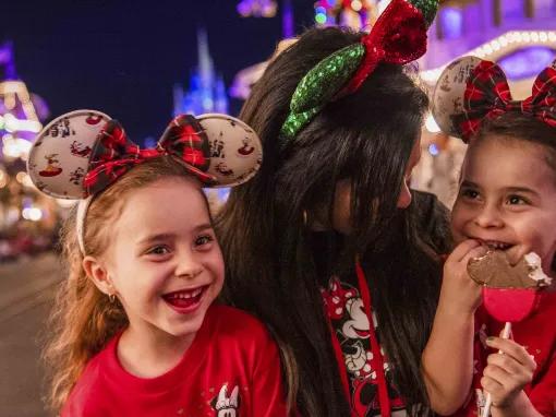 Guests enjoying yuletide treats at Mickey’s Very Merry Christmas Party in Magic Kingdom Park