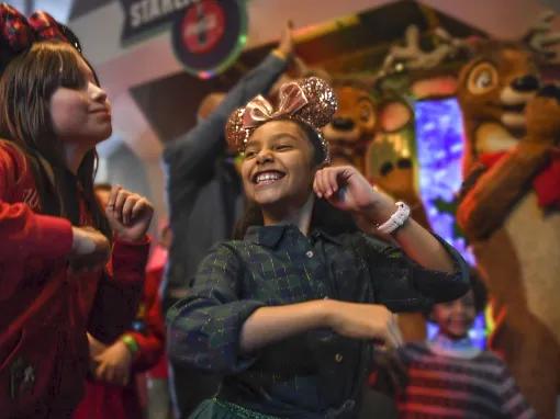 Guests dancing at Mickey’s Very Merry Christmas Party in Magic Kingdom Park