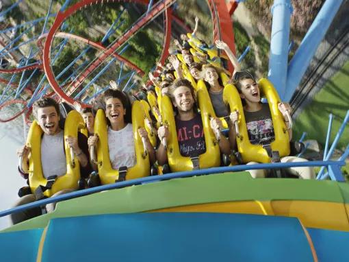 Guests riding Dragon Khan at PortAventura theme park