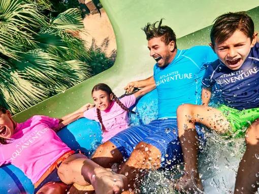 Family enjoying Aquaconda water slide at Aquaventure Dubai