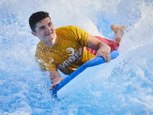 Man riding a wave on Surf's Up at Aquaventure Dubai