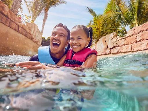 Father and daughter enjoying the raging rapids at Aquaventure Dubai