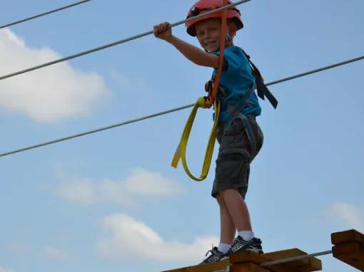 Boy on the Screamin’ Gator Zip Line experience at Gatorland