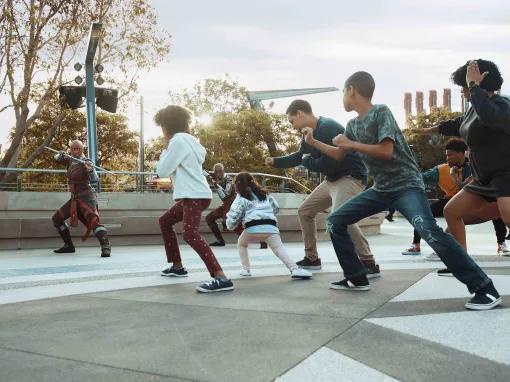 Guests training alongside Dora Milaje and General Okoye at Warriors of Wakanda, Avengers Campus at Disney California Adventure Park
