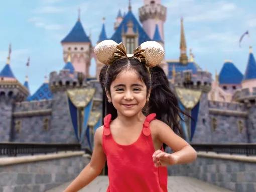 Girl in front of Sleeping Beauty Castle, Disneyland Park in California