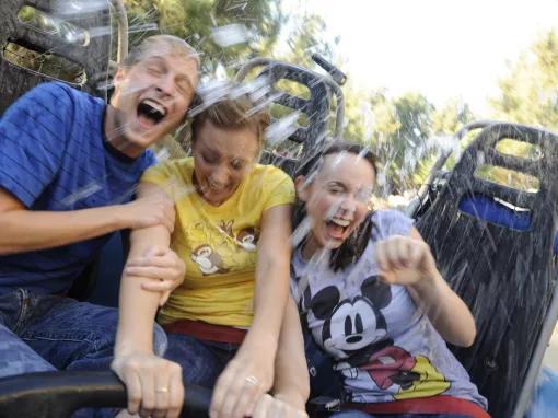 Guests getting wet on Grizzly River Run, Disney California Adventure Park