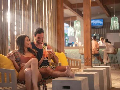 Couple enjoying a drink in the poolside bar,Universal's Endless Summer Resort - Dockside Inn and Suites