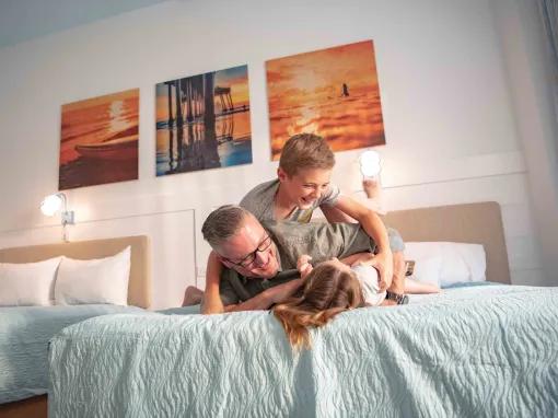 Father and son in a standard room at Universal's Endless Summer Resort - Dockside Inn and Suites