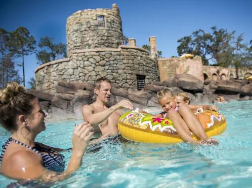 Family playing in the pool at Loews Portofino Bay Hotel