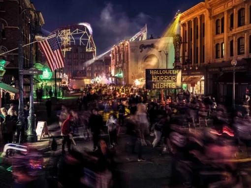 Shadowy crowd in a Halloween Horror Nights scare zone at Universal Orlando