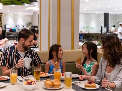 Family eating breakfast at Restaurant Le Bosquet at Dreams Castle Hotel Paris