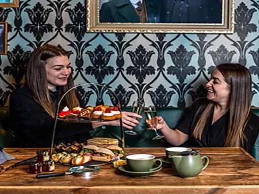 2-girls-enjoying-afternoon-tea