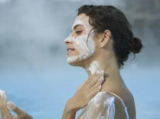 woman-putting-on-mask-cream