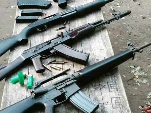 selection-of-guns-on-bench